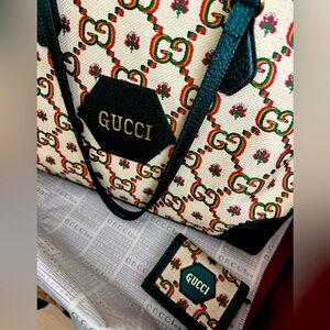 Gucci centennial tote and wallet.